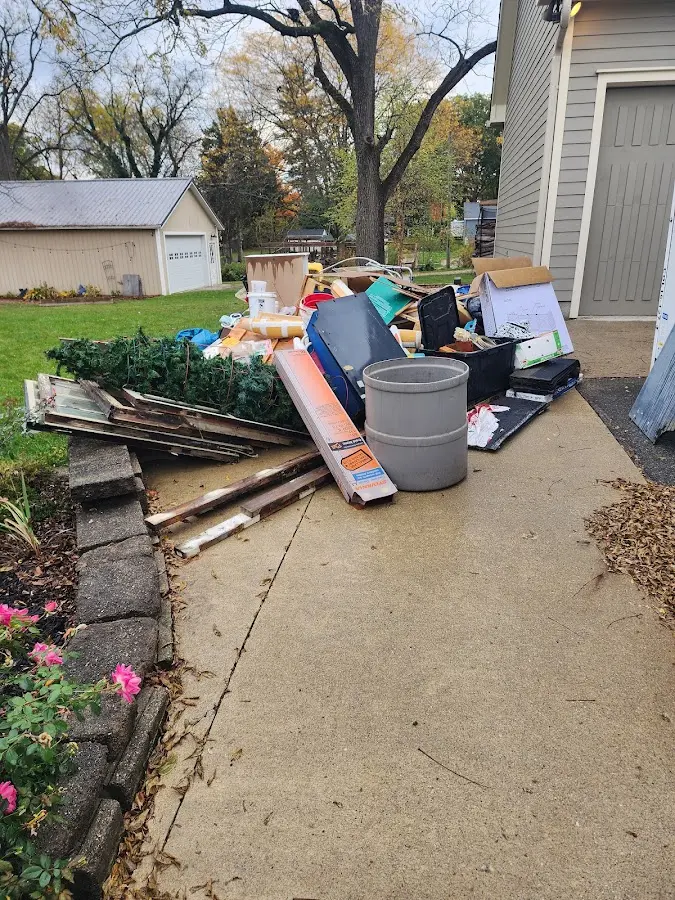 Dumpster being loaded with debris for Commercial Dumpster Rental in Vail